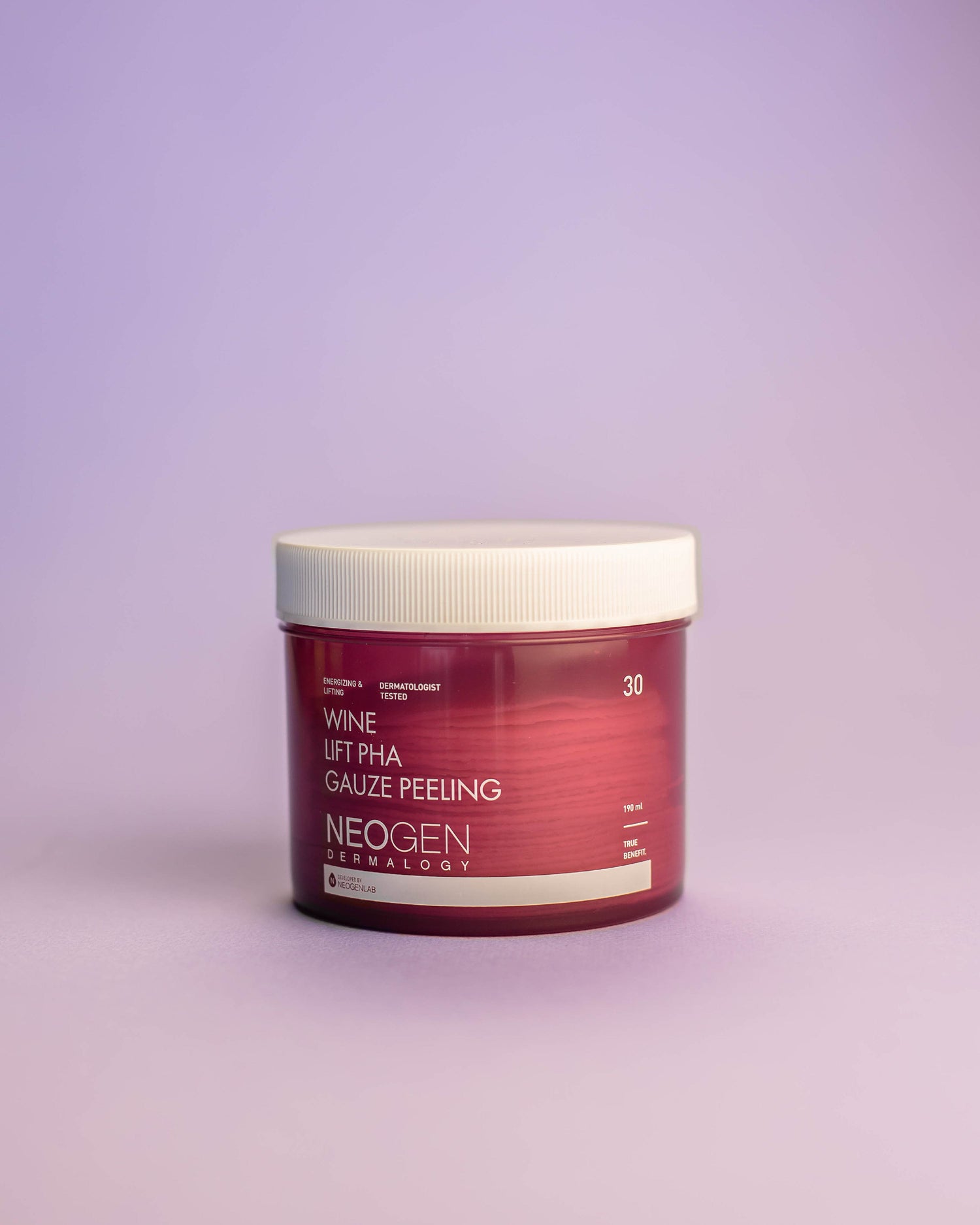 Imazh i tamponëve eksfoliues (Peeling Pad) 2-në-1 NEOGEN DERMALOGY Wine Lift PHA Gauze Peeling (30 copë). Eksfoliuesi largon qelizat e vdekura, ndalon plakjen e parakohshme dhe zbut rrudhat me Ekstrakt të Rrushit/Verës, acide PHA/AHA/BHA/LHA dhe Peptide